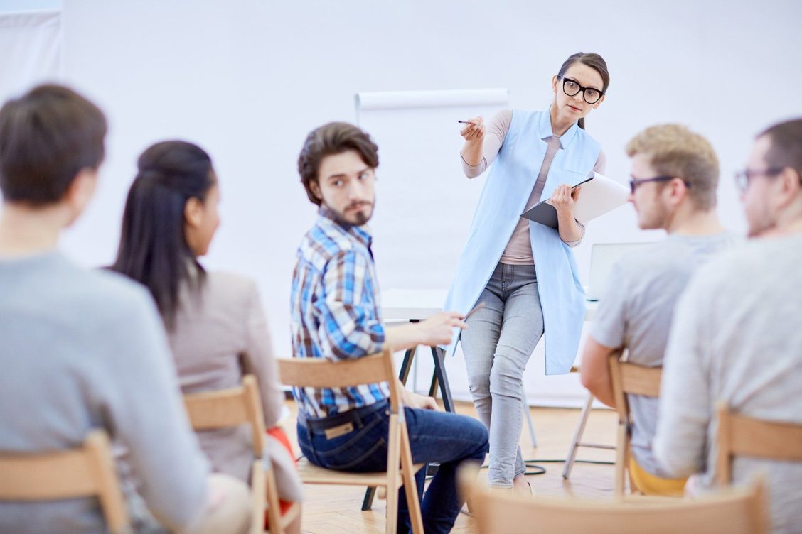 A clinician answering questions from a group